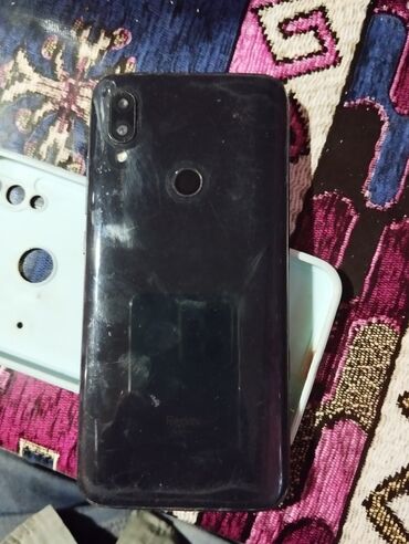 телефон fly ezzy 7 black: Xiaomi Redmi 7, 32 ГБ, цвет - Черный, 
 Сенсорный, Отпечаток пальца, Две SIM карты
