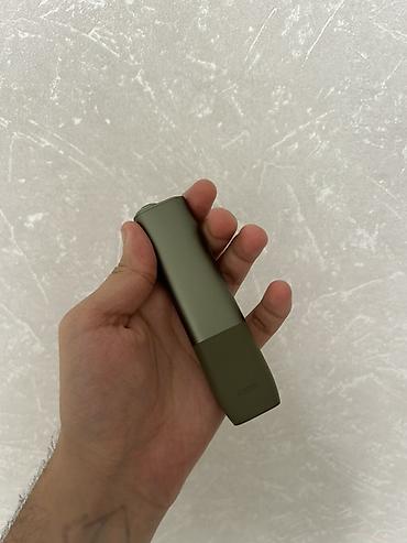 iqos stick: Məhsul: IQOS Iluma One (yaşıl rəng) Xüsusiyyətlər: - Tütün çubuqları — 1