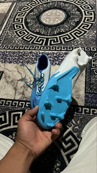золотой мяч: Бутсы Nike Phantom Vapor 15 Club MDS FG/MG голубого цвета с белыми и