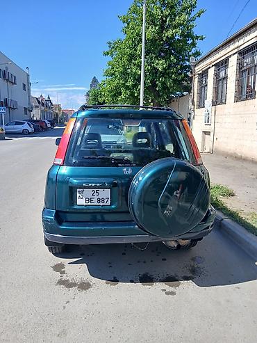 offroad tekerler: Honda CR‑V (1-ci nəsil) – yaşıl rəngli, 5 qapılı, şəhər və yüngül — 10