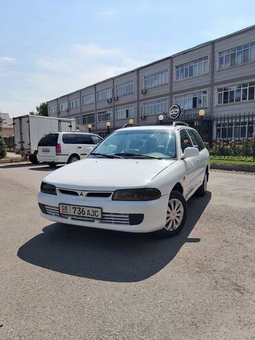 оборудование для производства макаронных изделий бу цена: Универсал Mitsubishi Lancer белого цвета, оснащенный багажником на