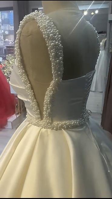 Свадебные платья и аксессуары: Gəlinlik – klassik “ball gown” siluetli, atlas parça. - Rəng: İvori/ — 4