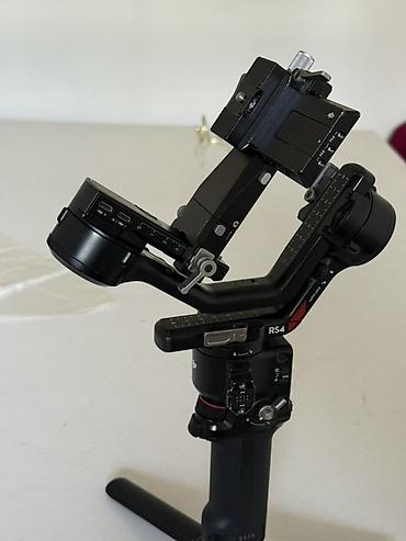Фото и видеокамеры: Стабилизатор для камер DJI RS 4 - Профессиональный трёхосевой — 2