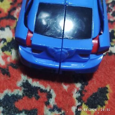 Игрушки: Игрушка-трансформер, способная менять форму из автомобиля в робота — 7