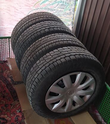 шины 2455519: Продаю комплект колес 205/65 R15 для Тойота . Состояние 4+ Колпаки