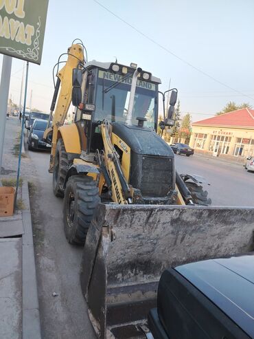 Avtomobil satışı: New Holland markalı, sarı və qara rəngli ekskavator. Yol tikintisi