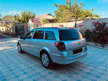 opel təkərləri: Opel Astra Caravan (universál kuzov), gümüşü rəng. Əsas məlumat: - — 3