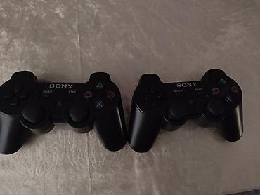 Video oyunlar və konsollar: Sony DualShock 3 simsiz oyun pultları (2 ədəd) - Model: CECHZC2E - — 1