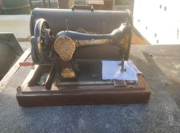 корпус комп: Тигүүчү машина Singer, Механикалык