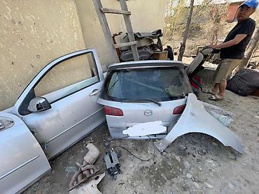 Двери и комплектующие: Дверь Передняя левая Mazda, Оригинал — 1