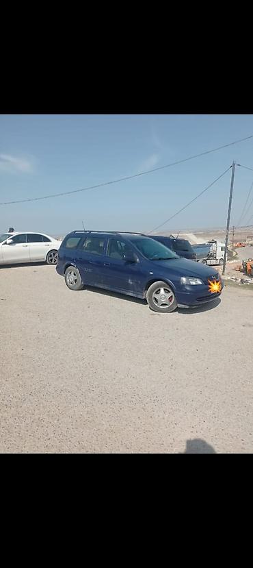 Opel Astra Caravan (universal kuzov), tünd mavi rəng. Xüsusiyyətlər lalafo.az -da Opel Astra Caravan (universal kuzov), tünd mavi rəng. Xüsusiyyətlər