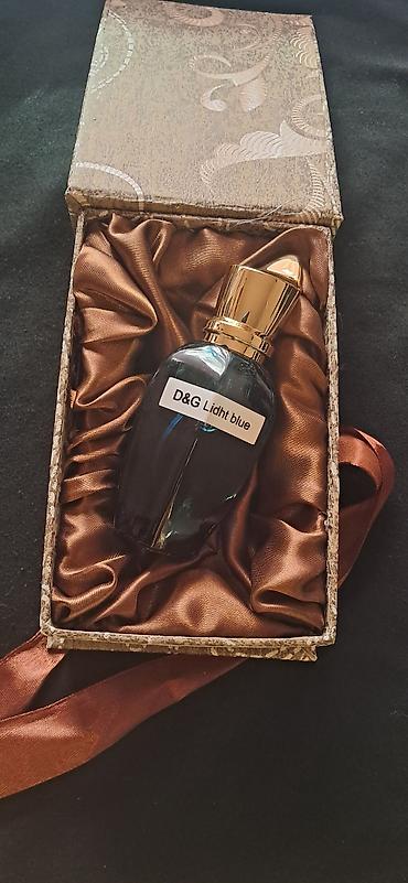 dini hediyyeler: D&G Light Blue ətiri - Şüşə dizaynı: tünd şüşə flakon, qızılı — 1