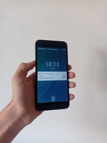 Сковородки: Xiaomi Mi A1, 64 ГБ, цвет - Черный, 
 Отпечаток пальца, Две SIM карты