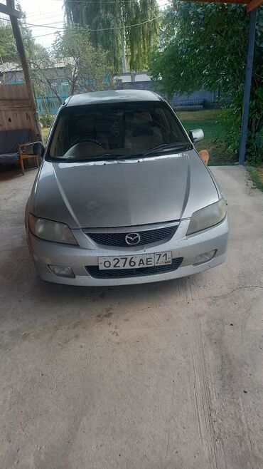 купить японский минитрактор с куном: Mazda Familia: 2003 г., 1.5 л, Автомат, Бензин, Седан