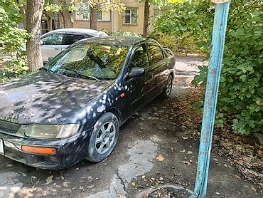 Транспорт: Mazda 323, седан, приблизительно конец 1990‑х – начало 2000‑х годов — 6