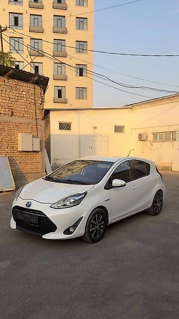 roewe er6: Toyota Prius C: 2018 г., Вариатор, Гибрид, Хэтчбэк — 7