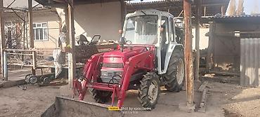 Тракторы ДТ-75: Трактор с фронтальным погрузчиком и навесным оборудованием Описание — 2