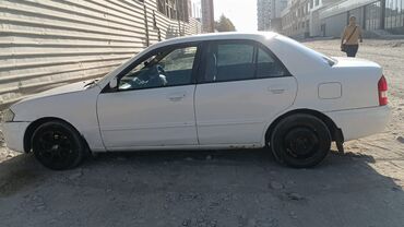 уна тетиктери: Mazda Familia: 1999 г., 1.5 л, Автомат, Бензин, Седан