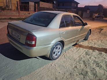 90: Mazda 323: 2000 г., 1.5 л, Автомат, Бензин, Седан — 4