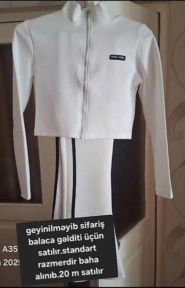 don sekilleri: - Ağ idman dəsti: fermuarlı üst, uzunqol, sinədə “World Model” loqosu — 1