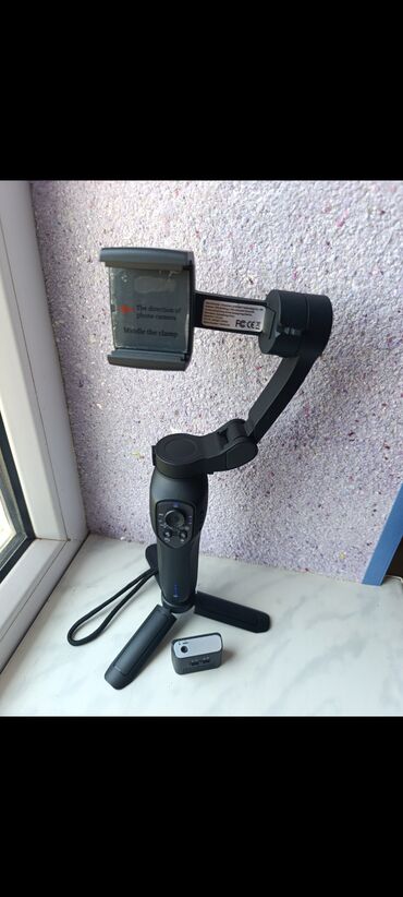 mini dondurucular: Smartfon üçün 3‑oxlu stabilizator + mini üçayaqlı tripod və uzaqdan