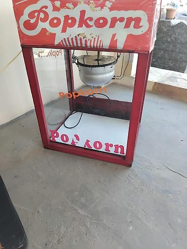 kafe aparati: Popkorn aparatı – şüşəli vitrinli, elektriklə işləyən model. Üst — 1