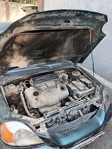 жд тупик: Kia Rio универсал (поколение начала 2000‑х), зеленый металлик машину — 6