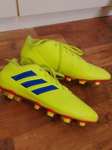 Kopačke: Fudbalske kopačke Adidas (model linije Nemeziz) za prirodnu travu - — 2