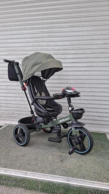 Детские велосипеды: Детский велосипед в синем цвете, оснащенный дополнительными боковыми — 4