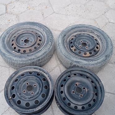 185 60 р15: Комплект из 4 стальных дисков R15 с зимними шинами Bridgestone — 1