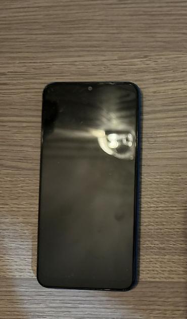 smart mini telefon: Mavi korpuslu smartfon Xüsusiyyətlər: - 6.x düymlük tam ekranlı ön — 2