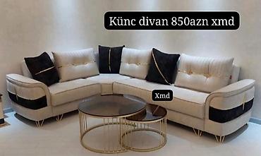 Künc divan – ölçülü L formada, 6 yastıqla. Açıq bej parça üzlük, qara