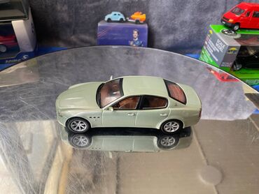 Avtomobil modelləri: Коллекционная модель Maserati Quattroporte V light green 2005 — 13