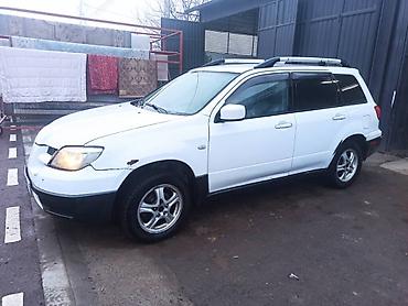 где принимают аккумуляторы: Mitsubishi Outlander: 2003 г., 2.4 л, Автомат, Газ, Кроссовер — 1
