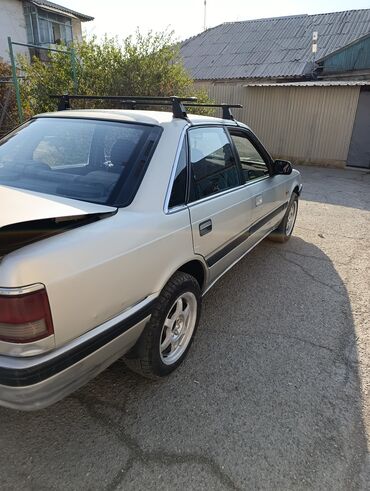 генезис авто: Mazda 626: 1990 г., 2 л, Механика, Бензин, Седан