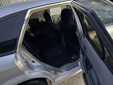 Mazda: Mazda 323: 2003 г., 1.3 л, Механика, Бензин, Универсал — 5