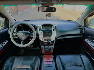 садовый измелчитель: Полноприводный внедорожник Lexus RX 400h в серебристом цвете с кожаным