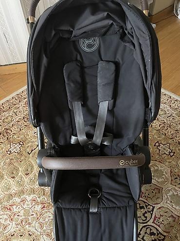 ам ням: Прогулочная коляска Cybex (линейка Priam 4— фирменная эмблема и бренд — 2