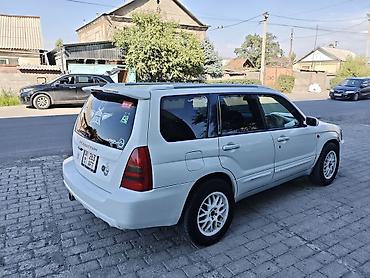машина номер аукцион: Subaru Forester: 2002 г., 2 л, Автомат, Газ, Универсал — 1