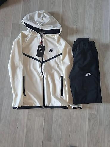 Gornji i donji deo: Ženska Nike trenerka – jakna sa kapuljačom + donji deo - Model — 8