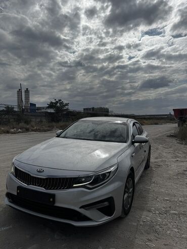 кия к5 2023: Автомобиль Kia K5 акула морда в элегантном серебристом цвете