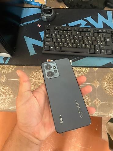 Техника и электроника: Xiaomi 12, цвет - Черный, 
 Отпечаток пальца — 2