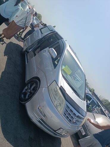 купить тойота альфард в бишкеке: Серебристый минивэн Toyota Alphard с тонированными задними стеклами и