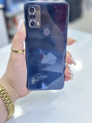 сотовый телефон fly ts113: TCL 20B smartfonu. Telefon 64 GB daxili yaddaşa və 4 GB operativ