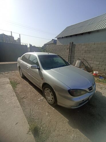 опель фронтера а: Автомобиль Nissan Primera серебристого цвета, кузов седан. Практичный