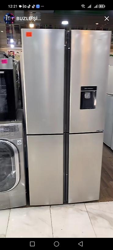 Dörd qapılı, inox rəngli Side-by-Side soyuducu. Sağ ön qapıda su/ice
