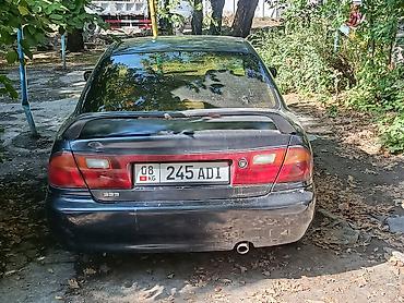 Транспорт: Mazda 323, седан, приблизительно конец 1990‑х – начало 2000‑х годов — 9