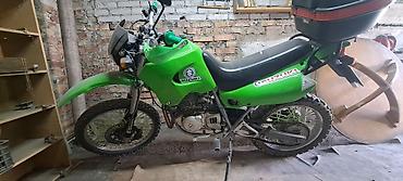 suzuki 200: Мотоцикл Suzuki (эндуро/dual-sport) зелёного цвета. Основные — 3
