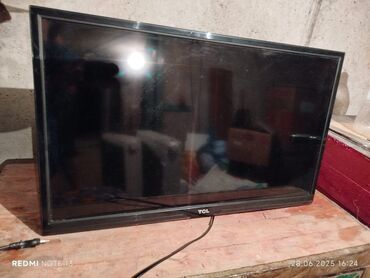 купить экран для компьютера: Телевизор TCL, модель LED32S3900. На задней панели имеются крепления