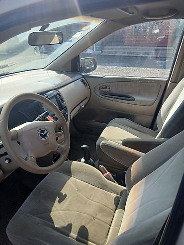 avtomobil salonu: Mazda miniven salonu – orijinal hissələr - Sükan: Mazda loqolu, hava — 3